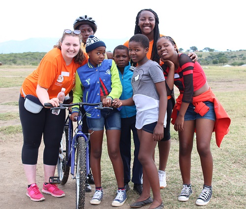group of south african students and leeds students smiling with bikes