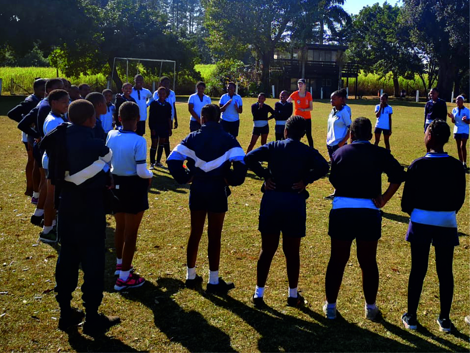 Children being taught netball skills in south africa