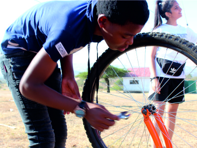South African Student fixing bike