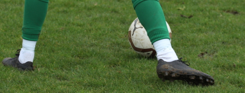 close up of someone's boots playing football