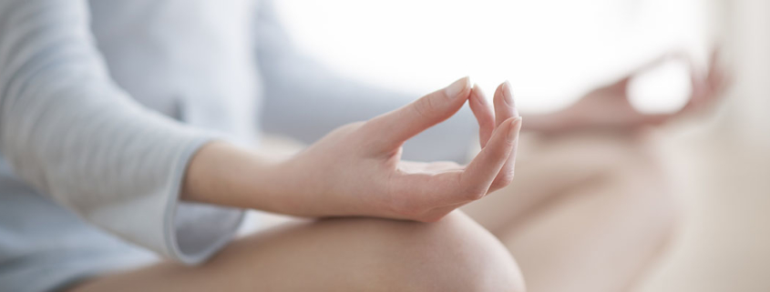 female hands meditating