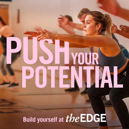 People squatting with extended arms in an exercise class. Text says: 'Push your potential. Build yourself at The Edge'
