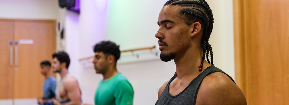 Young men in a yoga class