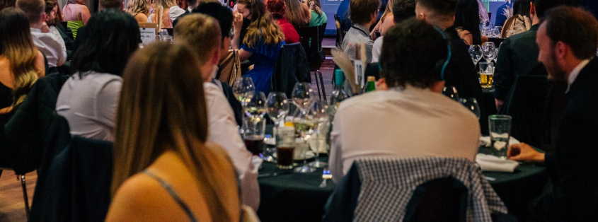 People sat at table during an awards dinner