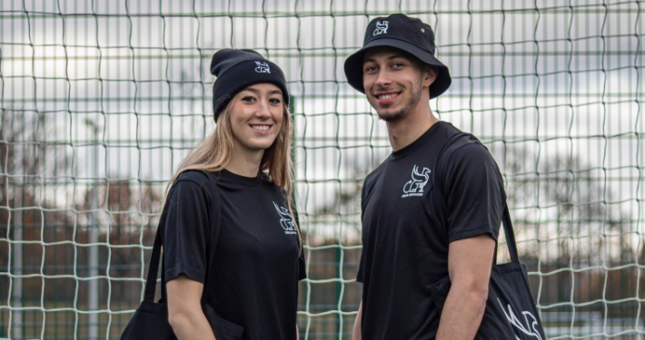 Young woman and young man modelling Gryphon merchandise
