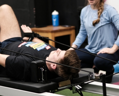 Member doing reformer pilates
