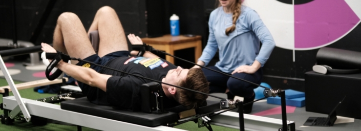 Member doing reformer pilates