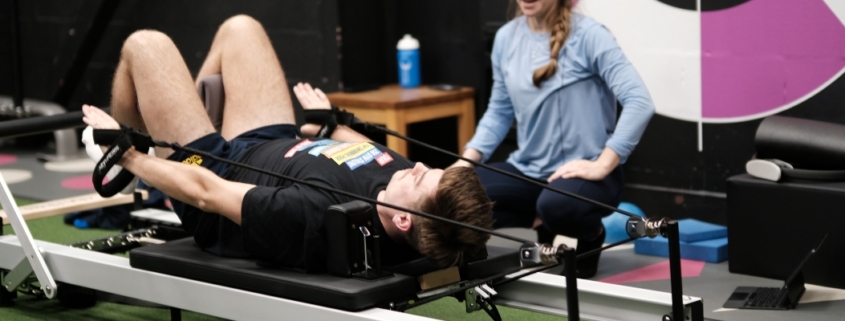 Member doing reformer pilates