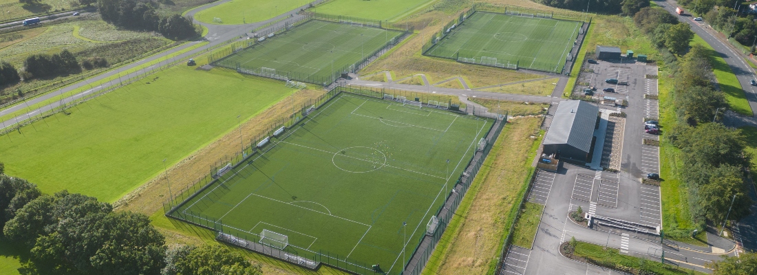 Aerial view over 3G football pitches
