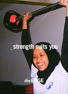 Student lifting weights