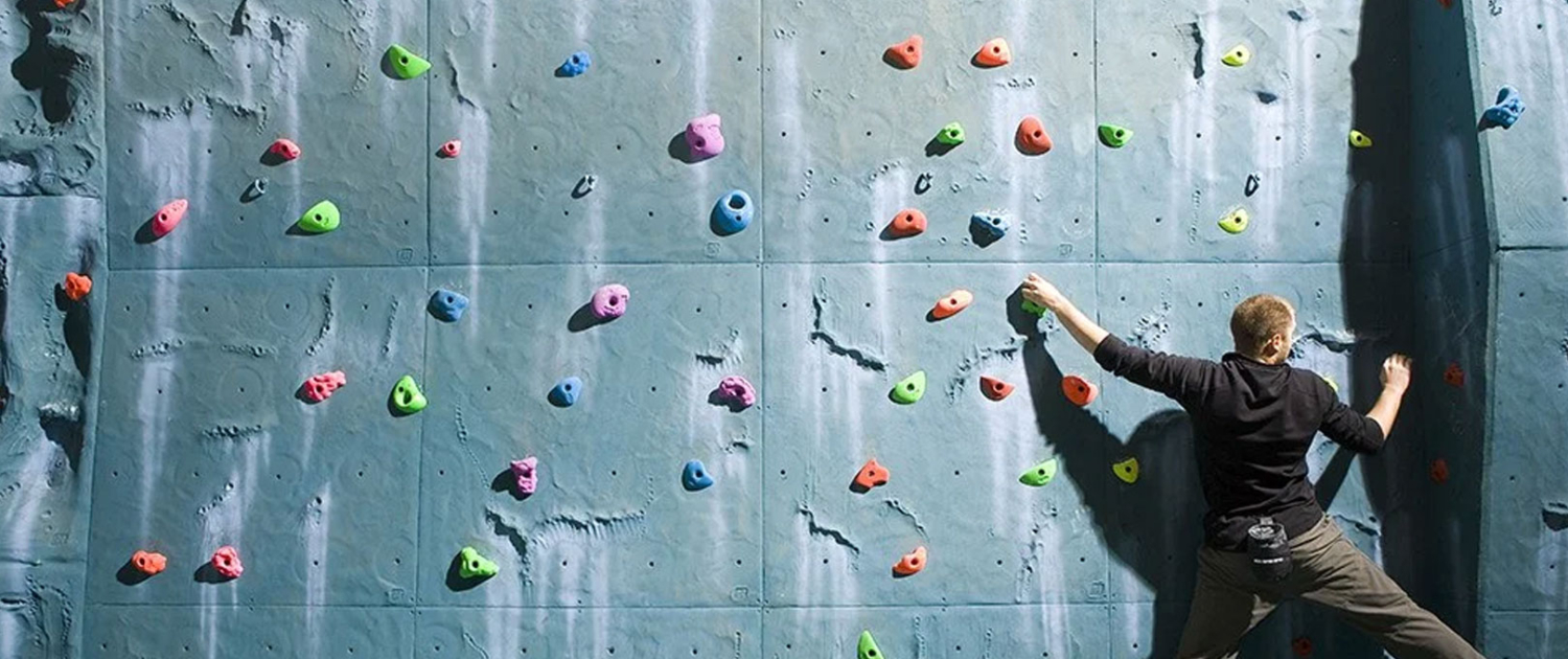 Climbing wall with a climber